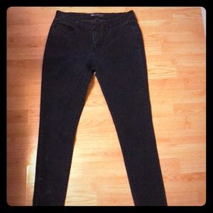A pair of all black Levi jeans